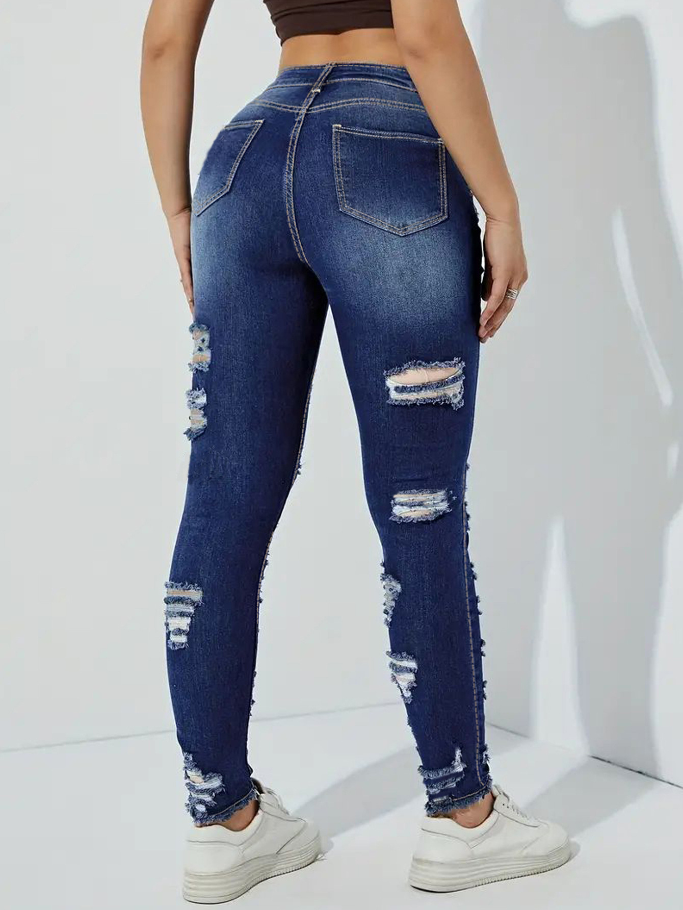 High Waist Distressed Skinny Jeans with Heavily Ripped Design